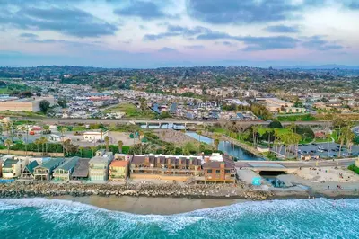 an aerial view of a resort on the beach at Oceanfront 1BR, Fully Furnished, Gated Parking in Oceanside