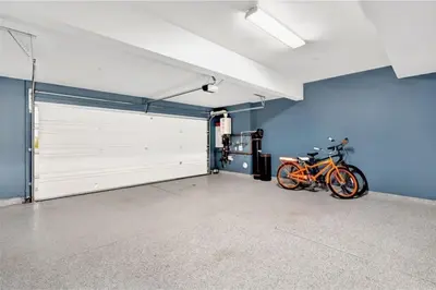 a bike parked next to a garage door at King Size, Patio, Xbox, Great Park in Irvine