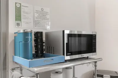 a microwave oven sitting on a shelf in a room at Good Life Resorts in San Diego
