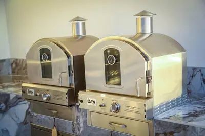 two ovens sitting on top of a counter at An Architectural masterpiece with unparalleled beauty, elegance and amenities in Temecula