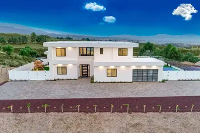 a rendering of a white house with a pool at An Architectural masterpiece with unparalleled beauty, elegance and amenities in Temecula