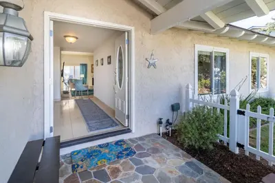 a front door of a home with a porch at Stunning 4 Bedroom 1 Level- Pool, Spa, Grass Yard, Fire Pit, Garage, BBQ in Mission Viejo