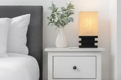 a white nightstand with a vase on it next to a bed at 3 Bedroom House - Fire Pit Table BBQ - 10 Guests in La Mesa