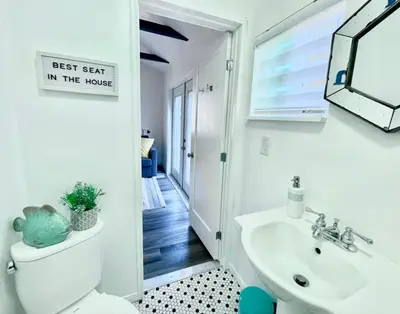 a bathroom with a white toilet and a sink at Hidden King Suite with Garden Parking - 4 Guest in La Mesa