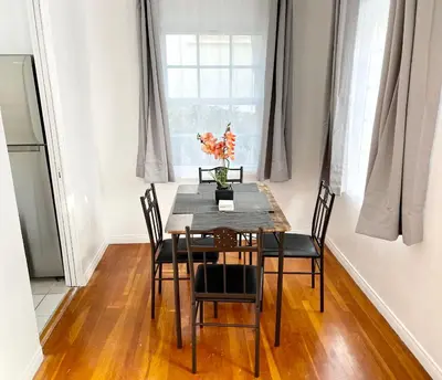 a dining room with a table and chairs and a window at 2 Bedroom - Ocean View Hot Tub Parking - 8 Guest in San Diego