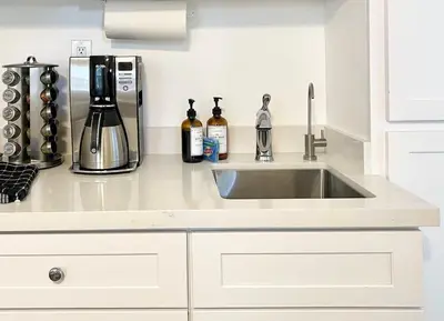 a kitchen counter with a sink and a coffee maker at Hidden Gem with Hot Tub and Parking - 4 Guests in San Diego