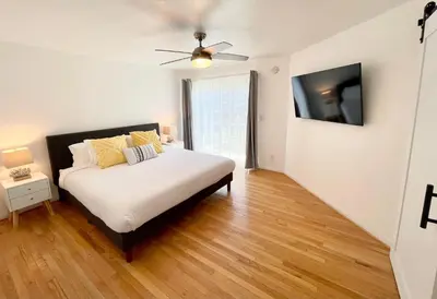 a bedroom with a bed and a ceiling fan at Hidden Gem with Hot Tub and Parking - 4 Guests in San Diego