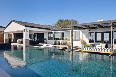 a house with a swimming pool in front of a house at Panoramic Ocean sunset Views with Heated Pool & Spa best location in San Diego