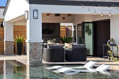 a house with a swimming pool and a patio at Panoramic Ocean sunset Views with Heated Pool & Spa best location in San Diego