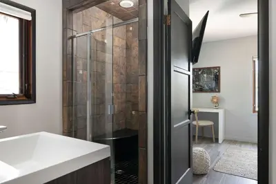 a bathroom with a shower and a sink at Panoramic Ocean sunset Views with Heated Pool & Spa best location in San Diego