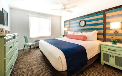 a bedroom with a large bed with a wooden headboard at San Diego - Mission Valley Condos in San Diego