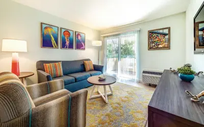 a living room with a couch and a table at San Diego - Mission Valley Condos in San Diego