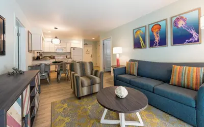 a living room with a couch and a table at San Diego - Mission Valley Condos in San Diego