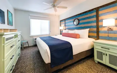 a bedroom with a large bed with a wooden headboard at San Diego - Mission Valley Condos in San Diego