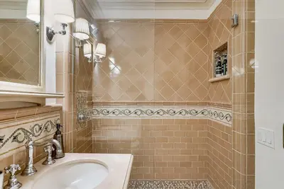 a bathroom with a sink and a shower at Luxury, renovated, oceanfront home with incredible deck & views - dogs welcome in San Diego