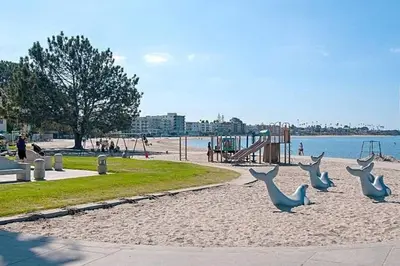 a park with statues of deer on the beach at Beach House In The Heart Of PB in San Diego