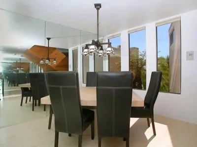 a dining room with a wooden table and chairs at Stunning View Mission Bay Luxury Home Private Pool in San Diego