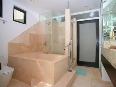a large bathroom with a tub and a toilet at Stunning View Mission Bay Luxury Home Private Pool in San Diego
