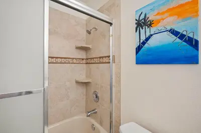 a bathroom with a shower and a painting on the wall at Sweet Escape - Family Retreat - Vibrant - Spa in San Diego