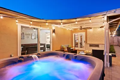a hot tub in the middle of a room with lights at Sweet Escape - Family Retreat - Vibrant - Spa in San Diego