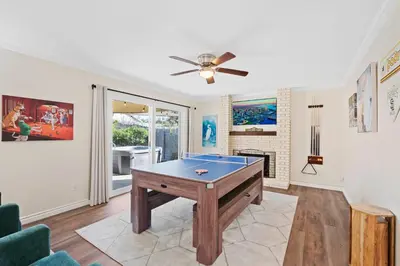 a living room with a pool table in it at Sweet Escape - Family Retreat - Vibrant - Spa in San Diego