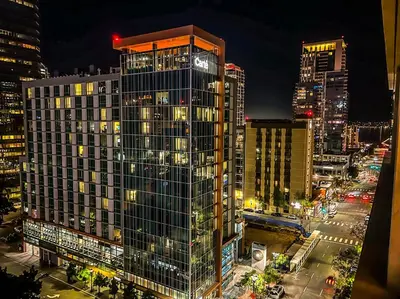 a tall building in a city at night at Italyhaus in San Diego