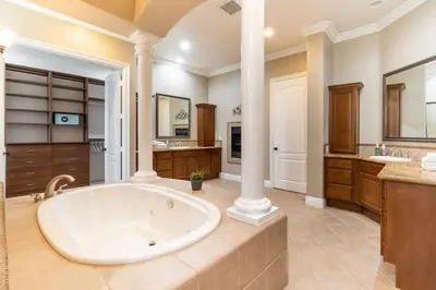 a large bathroom with a large tub in the middle at Temecula Wine Country Villa in Temecula