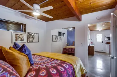 a bedroom with two beds and a ceiling fan at Avoyer One Bedroom Guesthouse - La Mesa in La Mesa