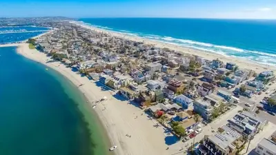 an aerial view of a beach with houses and the ocean at Mission Beach Townhome Getaway in San Diego