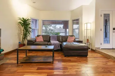 a living room with a couch and a coffee table at Canyon Breeze - Private Home with Hot Tub & Views in San Diego