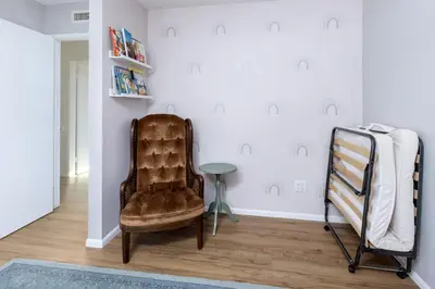 a living room with a chair and a table at Echo by Coast to Cactus - Family-Friendly Home in La Mesa
