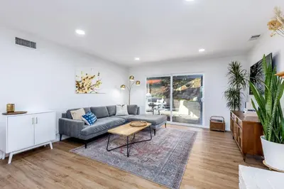 a living room with a couch and a table at Echo by Coast to Cactus - Family-Friendly Home in La Mesa