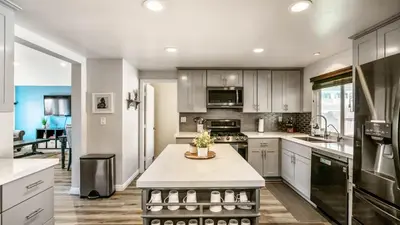 a kitchen with a island in the middle of it at San Diego Family Getaway - Spa, Pool, and Patio in San Diego