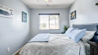 a bedroom with a bed and a window at San Diego Family Getaway - Spa, Pool, and Patio in San Diego