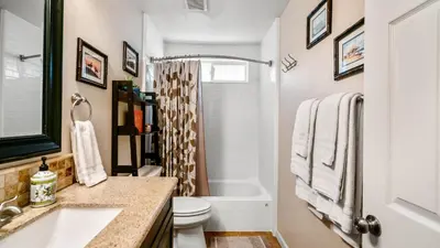 a bathroom with a sink and a toilet and a shower at San Diego Family Getaway - Spa, Pool, and Patio in San Diego