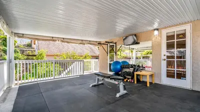 an empty patio with a chair and a table at San Diego Family Getaway - Spa, Pool, and Patio in San Diego