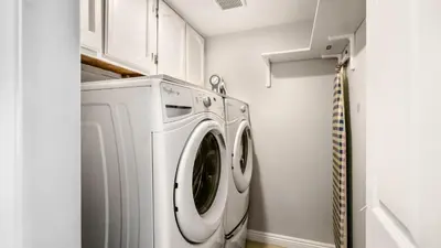 a white washer and dryer in a laundry room at San Diego Family Getaway - Spa, Pool, and Patio in San Diego