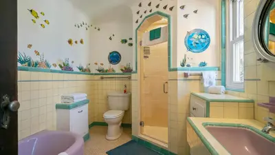 a bathroom with a sink and a toilet and a tub at Mediterranean-Style Villa in Point Loma in San Diego