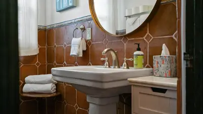 a bathroom with a sink and a mirror at Mediterranean-Style Villa in Point Loma in San Diego
