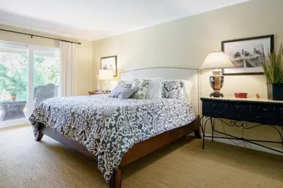 a bedroom with a bed and a window at Luxury Home with Heated Pool - Spa and Lighted Pickle Ball Court in San Diego