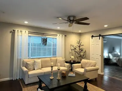 a living room with a couch and a table at HC Accessible 4 Bed 3 Bath with Sparkling Pool and Spa-we have lifts and roll in shower in Santee