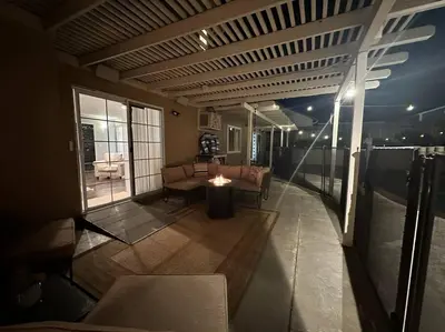 a living room with a couch and a table at HC Accessible 4 Bed 3 Bath with Sparkling Pool and Spa-we have lifts and roll in shower in Santee