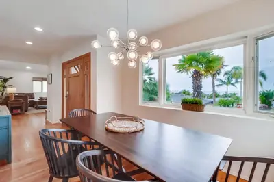 a dining room with a table and chairs at Ocean & Bay Views Pool & Hot Tub Rooftop Patio in San Diego
