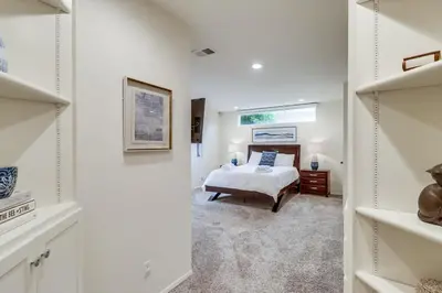 a white bedroom with a bed and a window at Ocean & Bay Views Pool & Hot Tub Rooftop Patio in San Diego