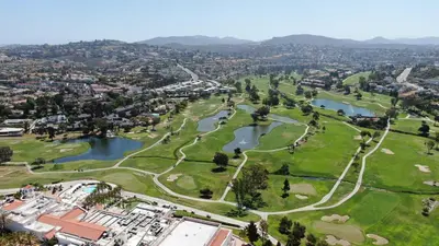 an aerial view of a park with two lakes at Beautifully Remodeled - Private Balcony - Pool View - BBQ Access - Gated Reserved Parking in Encinitas
