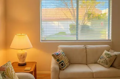 a living room with a couch and a window at Western Horizon Home in Hemet