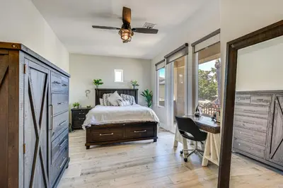 a bedroom with a bed and a desk and a window at LA COSTA Valley Newly Remodeled Gem in Carlsbad