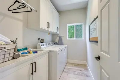 a kitchen with white cabinets and a sink at LA COSTA Valley Newly Remodeled Gem in Carlsbad