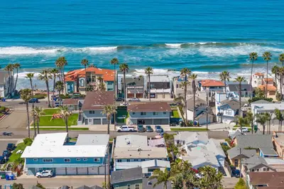 an aerial view of a beach with houses and the ocean at Amazing Place by the Sea - O'side Palms in Oceanside