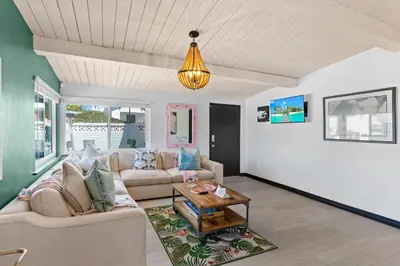 a living room with a couch and a table at Amazing Place by the Sea - O'side Palms in Oceanside